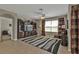 Inviting living room with a ceiling fan, large TV, striped rug, and comfortable seating at 7325 Mikasa Dr, Punta Gorda, FL 33950