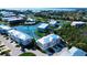 Stunning aerial view of the condo community with waterfront property and well-maintained landscaping near the ocean at 10311 Lands End Cir # 16, Placida, FL 33946