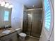 Bathroom with a glass-enclosed shower and granite vanity at 10311 Lands End Cir # 16, Placida, FL 33946