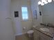 Cozy half bath featuring a granite countertop and nautical themed decorations at 10311 Lands End Cir # 16, Placida, FL 33946