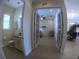 Half bath featuring a vanity with granite countertop and access to the open-concept living space at 10311 Lands End Cir # 16, Placida, FL 33946