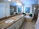 A bathroom with double sinks, tub and shower at 10311 Lands End Cir # 16, Placida, FL 33946