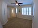 Bedroom with a ceiling fan, carpet flooring, and multiple windows at 10311 Lands End Cir # 16, Placida, FL 33946