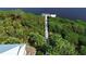 Aerial view of a private dock extending into the waterway at 10311 Lands End Cir # 16, Placida, FL 33946