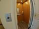 Interior of an elevator, showcasing the control panel, wood paneling, and safety features for convenient home access at 10311 Lands End Cir # 16, Placida, FL 33946