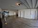 Spacious garage with a boat, ample storage and workspace, and multiple access doors at 10311 Lands End Cir # 16, Placida, FL 33946