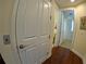 Hallway features wood floors and white doors leading to rooms at 10311 Lands End Cir # 16, Placida, FL 33946