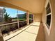 Covered patio area overlooking the landscaped yard and scenic pond at 10311 Lands End Cir # 16, Placida, FL 33946