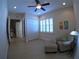 Sitting room with tile floors, closet, ceiling fan, white trim, and comfortable chairs at 10311 Lands End Cir # 16, Placida, FL 33946