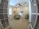 Sitting room with tile floors, ceiling fan and a chair and ottoman set at 10311 Lands End Cir # 16, Placida, FL 33946