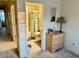Bathroom showing tiled floors, adjacent to dresser at 1186 Rio De Janeiro Ave # 106, Punta Gorda, FL 33983