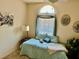 Comfortable bedroom with decorative window treatments and a cozy reading nook at 1186 Rio De Janeiro Ave # 106, Punta Gorda, FL 33983