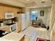 Efficient kitchen with stainless steel appliances and access to the staircase at 1186 Rio De Janeiro Ave # 106, Punta Gorda, FL 33983
