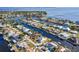 Aerial view of waterfront community with homes on canals and access to harbor at 121 Sinclair Se St, Port Charlotte, FL 33952