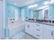 Bathroom featuring a large vanity with double sinks, a separate bathtub, and modern finishes at 121 Sinclair Se St, Port Charlotte, FL 33952