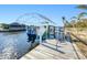 This private boat dock has two boat lifts, access to power and is ready for water activities at 121 Sinclair Se St, Port Charlotte, FL 33952