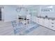 Bright dining area featuring a modern table with seating for four and stylish decor at 121 Sinclair Se St, Port Charlotte, FL 33952