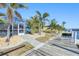 This beautiful backyard has a dock with access to the water and includes a large screened-in patio at 121 Sinclair Se St, Port Charlotte, FL 33952