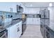 Elegant kitchen featuring stainless steel appliances, granite countertops, and stylish backsplash at 121 Sinclair Se St, Port Charlotte, FL 33952