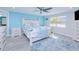 Bright main bedroom with a patterned comforter, and a ceiling fan at 121 Sinclair Se St, Port Charlotte, FL 33952