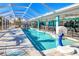 Enclosed pool area with basketball hoop, patio, and seating at 121 Sinclair Se St, Port Charlotte, FL 33952