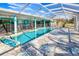 This home features a beautiful in-ground pool enclosed by a screened lanai with ample patio space at 121 Sinclair Se St, Port Charlotte, FL 33952