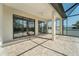Large covered patio with neutral pavers and ceiling fan at 13356 Rayburn Ln, Port Charlotte, FL 33981