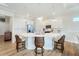 Bright kitchen features white cabinetry, stainless steel appliances, and a marble countertop island at 13356 Rayburn Ln, Port Charlotte, FL 33981