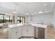Open floor plan with a kitchen island, stainless steel appliances, and views of the dining and living areas at 13356 Rayburn Ln, Port Charlotte, FL 33981
