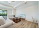 Cozy living room with tile flooring, neutral furniture, a glass coffee table, and a scenic painting above the base trim at 13356 Rayburn Ln, Port Charlotte, FL 33981