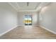 Large, bright bedroom with wood floors and a sliding glass door leading to the pool at 13364 Rayburn Ln, Port Charlotte, FL 33981