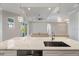 Kitchen island with stainless steel appliances, sink and marble countertops at 13364 Rayburn Ln, Port Charlotte, FL 33981