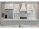 Modern kitchen with stainless steel appliances, island and marble countertops at 13364 Rayburn Ln, Port Charlotte, FL 33981