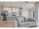 Bright, open-concept kitchen and living area with hardwood floors and neutral decor at 13364 Rayburn Ln, Port Charlotte, FL 33981