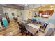 Open-concept dining area boasts modern décor and a nearby office nook with wood floors throughout at 1340 Rock Dove Ct # 143, Punta Gorda, FL 33950