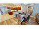 Open-concept dining area features modern light fixtures and wood floors leading into the eat-in kitchen at 1340 Rock Dove Ct # 143, Punta Gorda, FL 33950