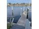Dock view shows waterfront access with private boat slip and dock steps at 1340 Rock Dove Ct # 143, Punta Gorda, FL 33950