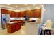 Spacious kitchen featuring wooden cabinets, stainless steel appliances, and granite countertops at 1340 Rock Dove Ct # 143, Punta Gorda, FL 33950