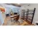 Cozy office near dining area, wood floors, ample shelving, and a comfortable workspace with nautical decorations at 1340 Rock Dove Ct # 143, Punta Gorda, FL 33950