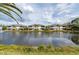 Scenic waterfront view from multiple home units overlooking the serene pond at 1706 Fountain View Cir, Venice, FL 34292