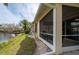 View of home's screened lanai, overlooking the serene waterfront at 1706 Fountain View Cir, Venice, FL 34292