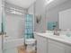 Bathroom features a tub-shower combo and a tiled floor at 1706 Fountain View Cir, Venice, FL 34292