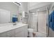 Bright bathroom features a white vanity and glass-enclosed shower at 1706 Fountain View Cir, Venice, FL 34292