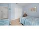Bedroom with neutral carpet features twin beds and ample closet space at 1706 Fountain View Cir, Venice, FL 34292