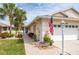 Close-up of charming residence with brick pathway and well-maintained landscaping at 1706 Fountain View Cir, Venice, FL 34292