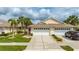 Charming home with a two-car garage, well-manicured lawn, and inviting curb appeal at 1706 Fountain View Cir, Venice, FL 34292