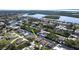 Aerial view of the property, highlighting its prime waterfront location with a screened pool and private dock at 17350 Bayharbor Cir, Port Charlotte, FL 33948