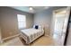 This comfy bedroom includes carpet, a ceiling fan, and a calming color scheme for a peaceful retreat at 17350 Bayharbor Cir, Port Charlotte, FL 33948