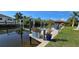 Private boat dock with lift offers direct access to the water, perfect for boating and fishing at 17350 Bayharbor Cir, Port Charlotte, FL 33948