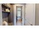 Convenient laundry room with modern washer/dryer, storage shelves, and a bright window at 17350 Bayharbor Cir, Port Charlotte, FL 33948